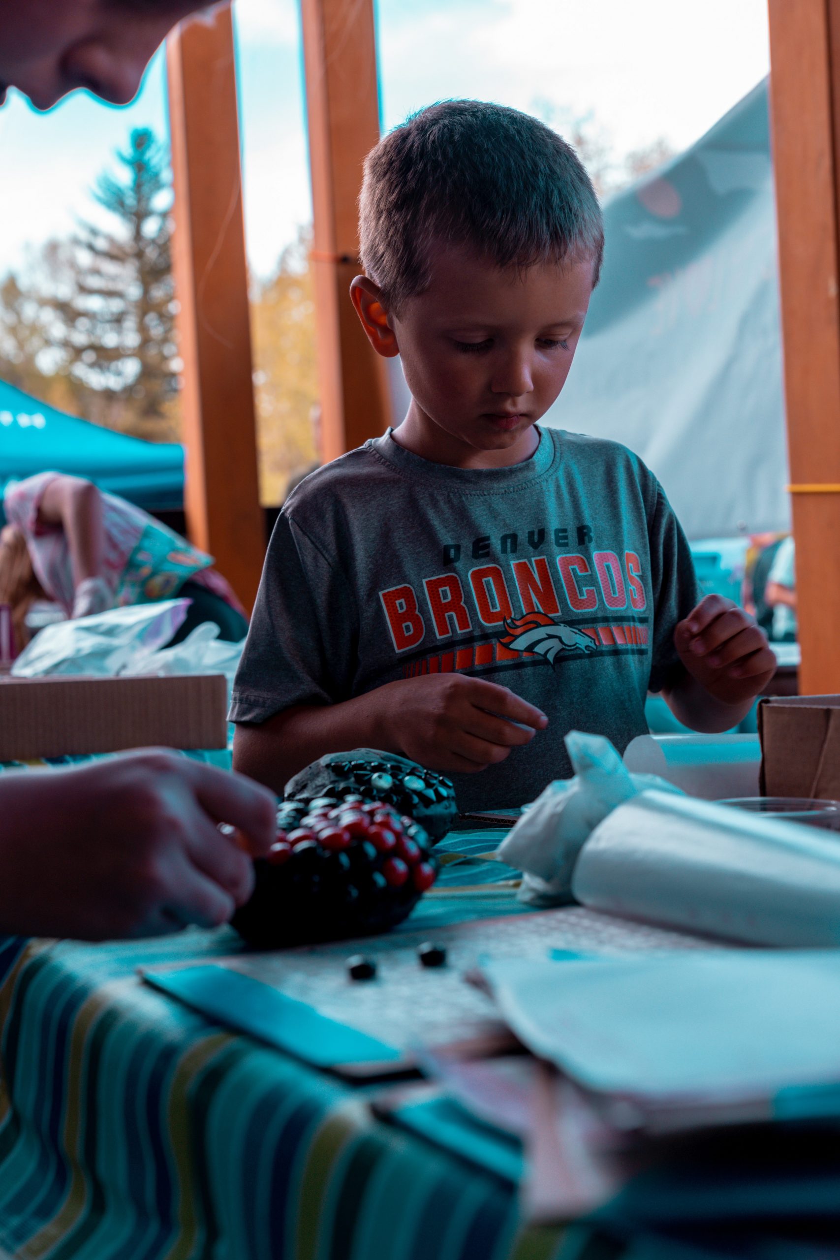 Artist Mary Gilles creates mosaic ladybugs to bring community together